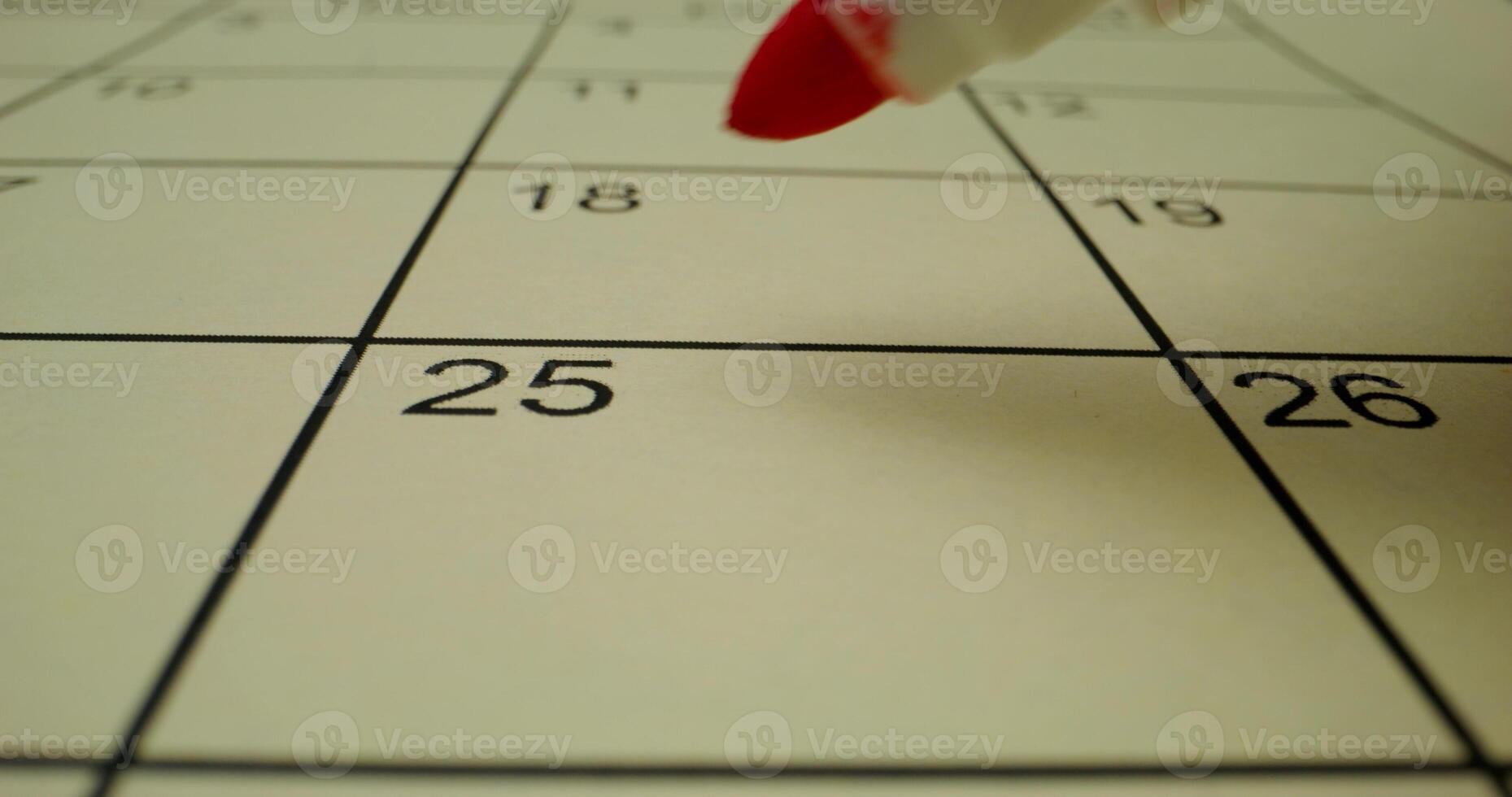 A red marker is pointing to a calendar photo