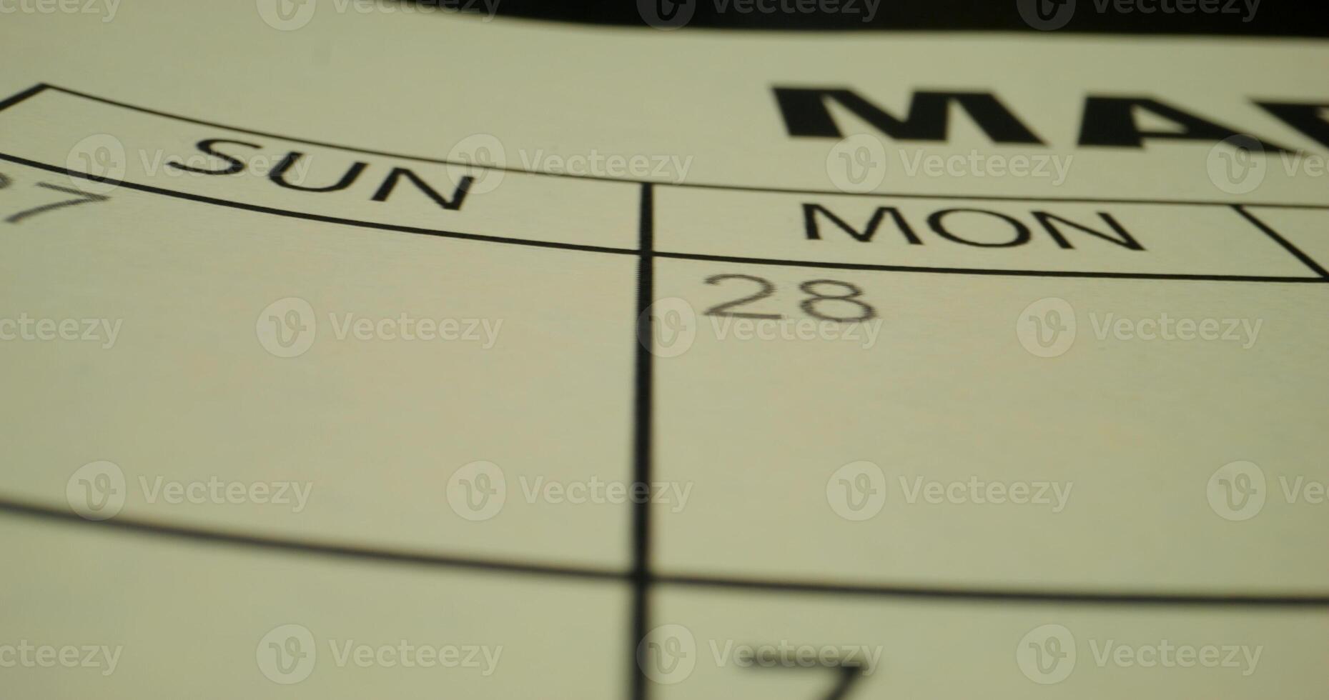 A close up of a calendar with the date of march photo