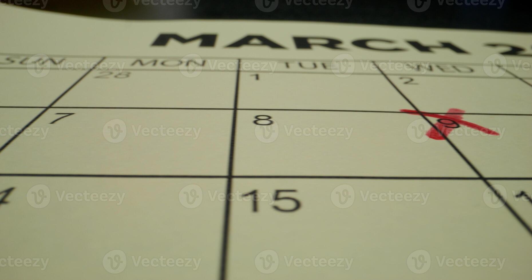 A calendar with the date march 20th circled photo
