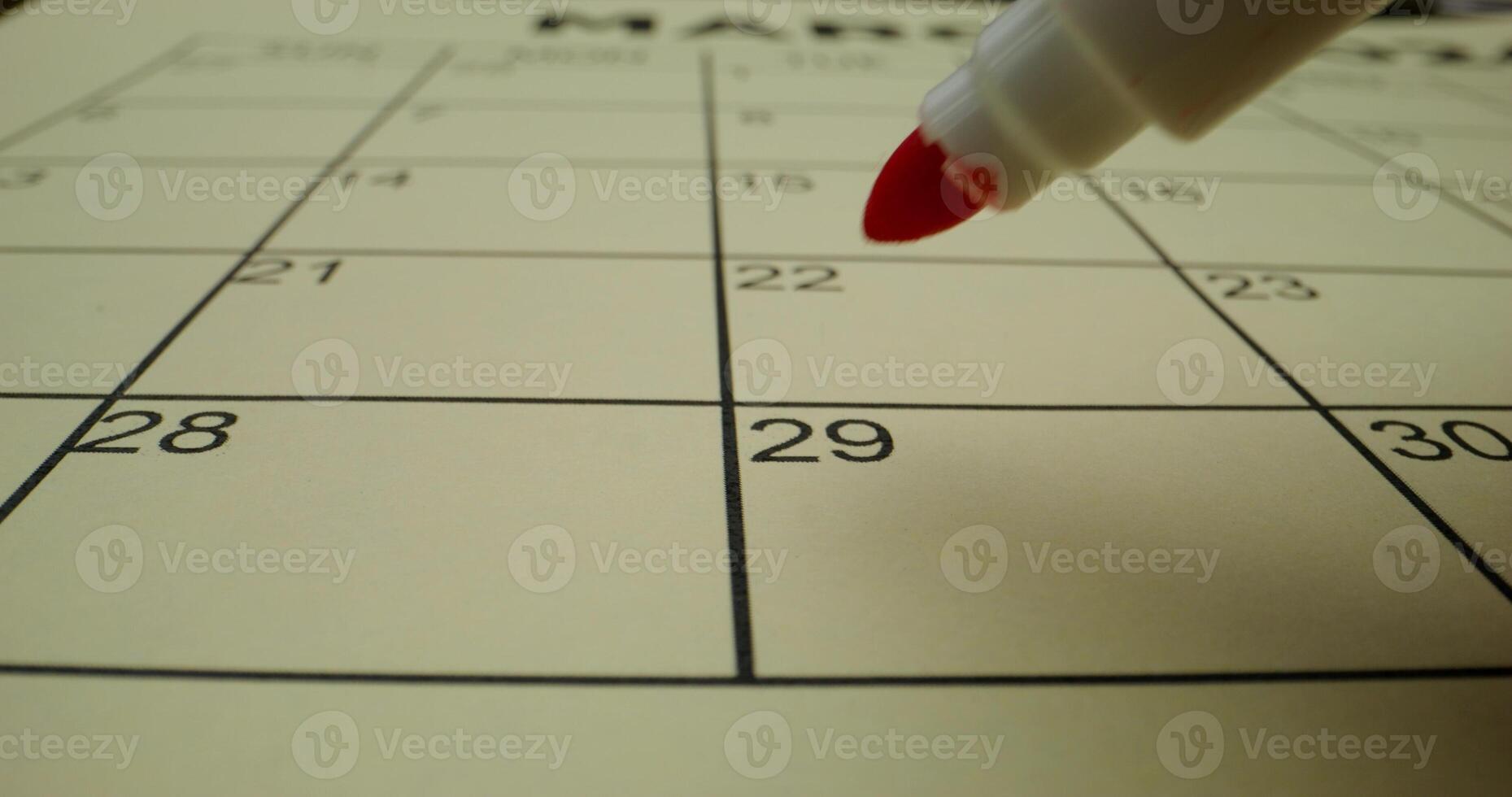 A red marker is pointing to the calendar photo