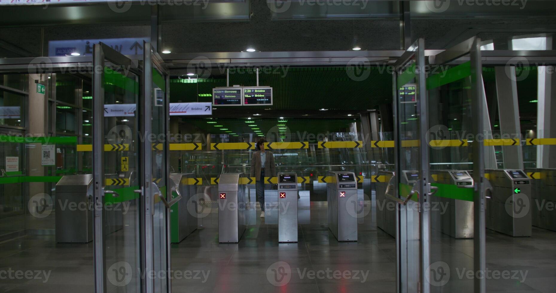 A woman leaves the subway station photo