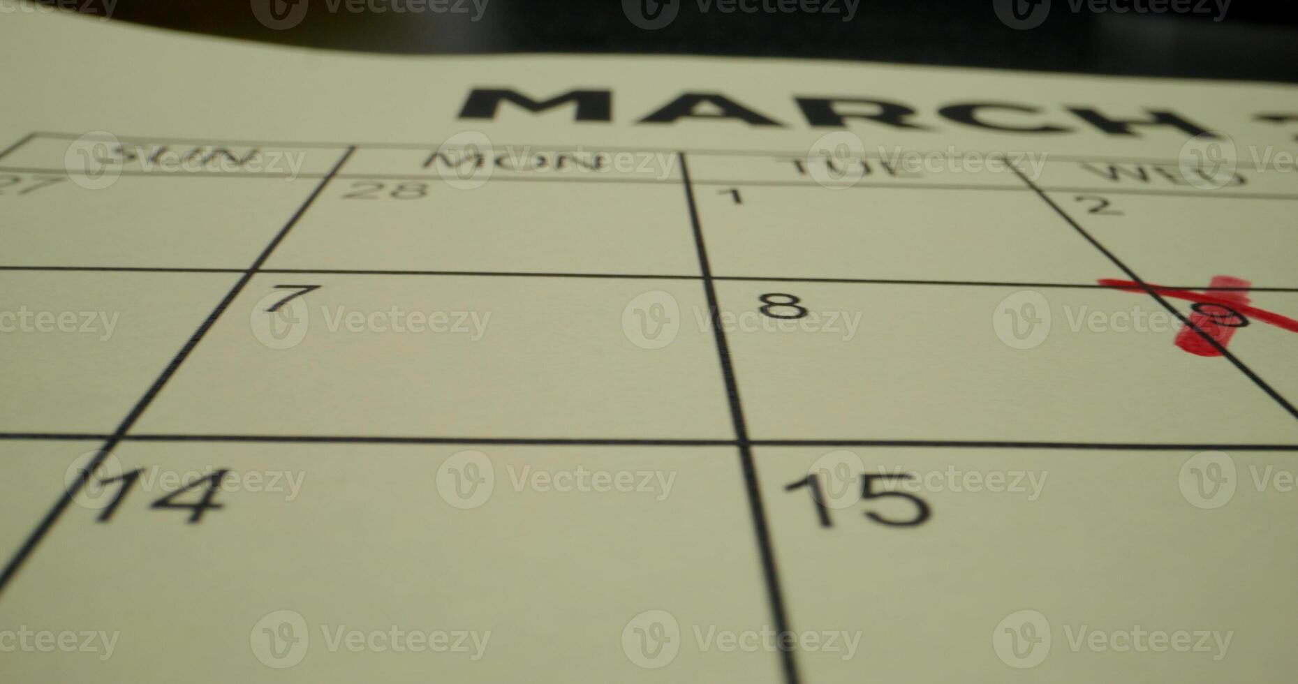 A calendar with a red cross on it photo
