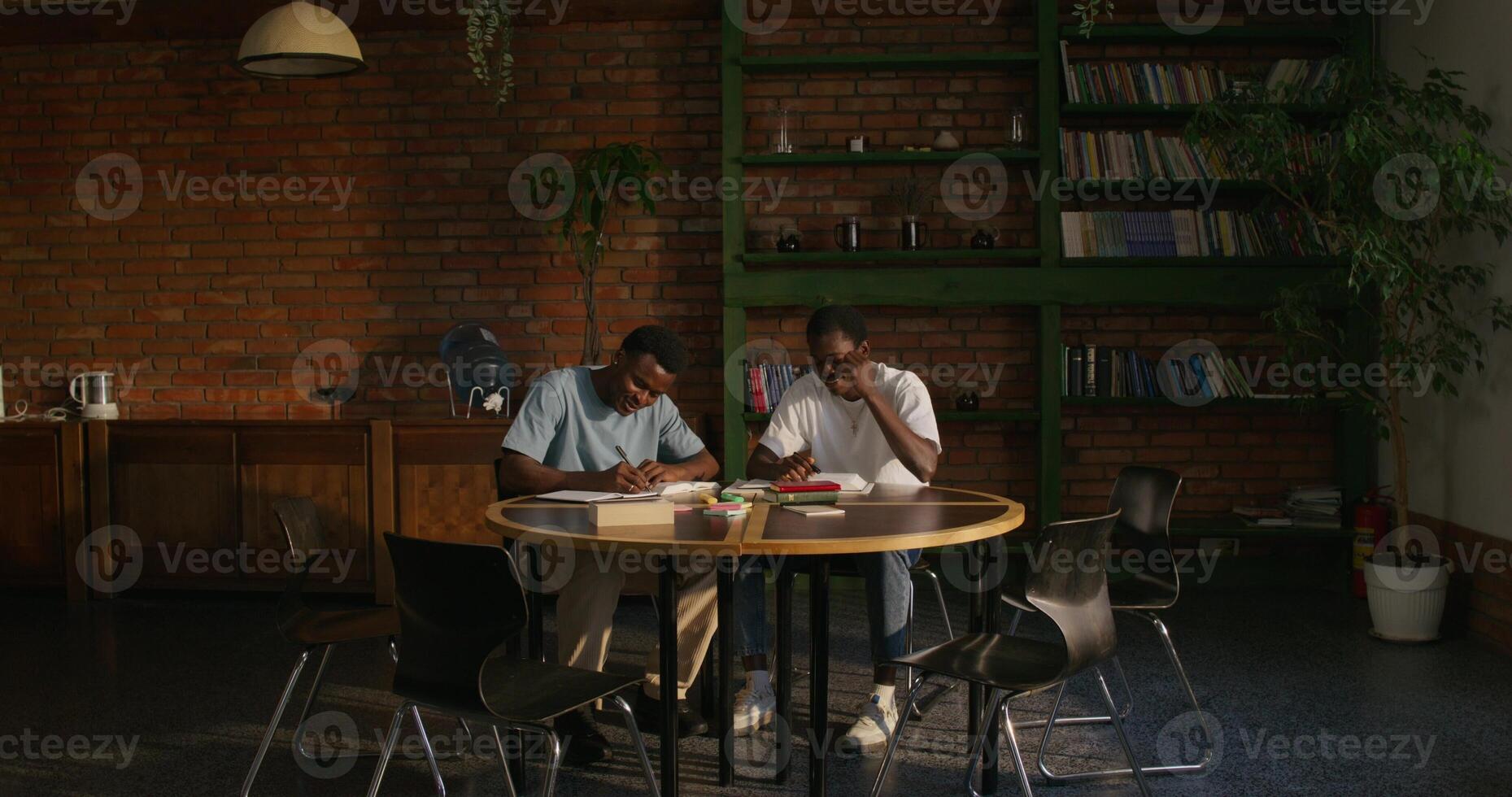 Two people sitting at a table photo
