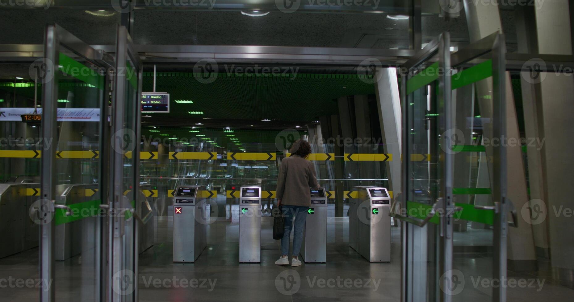 A person walking through an airport terminal photo
