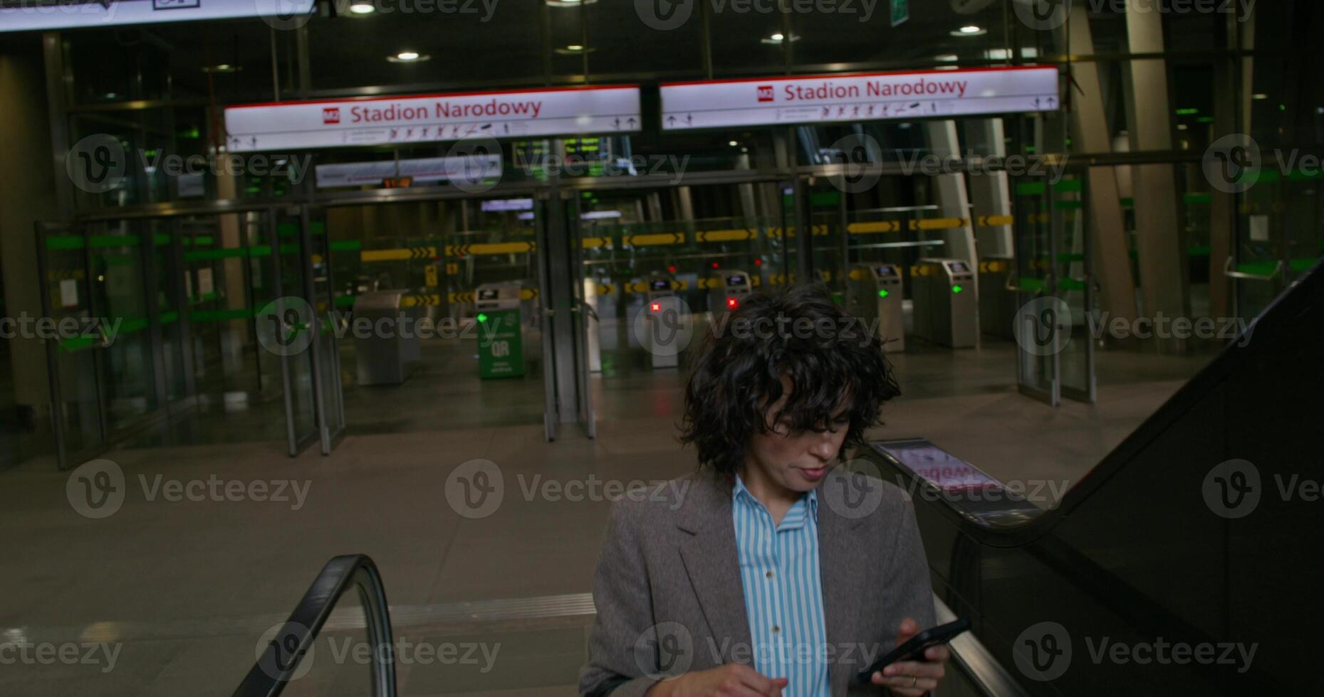 A woman is standing in an airport photo