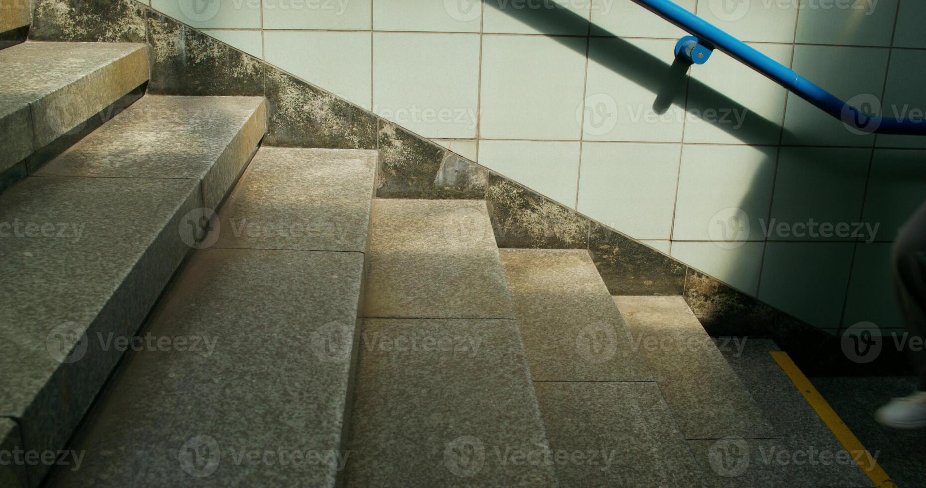 A woman walks up the stairs photo