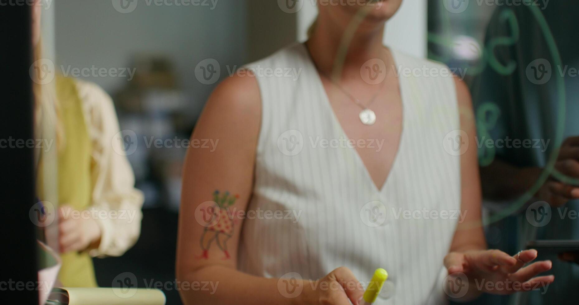 A woman holding a pen photo