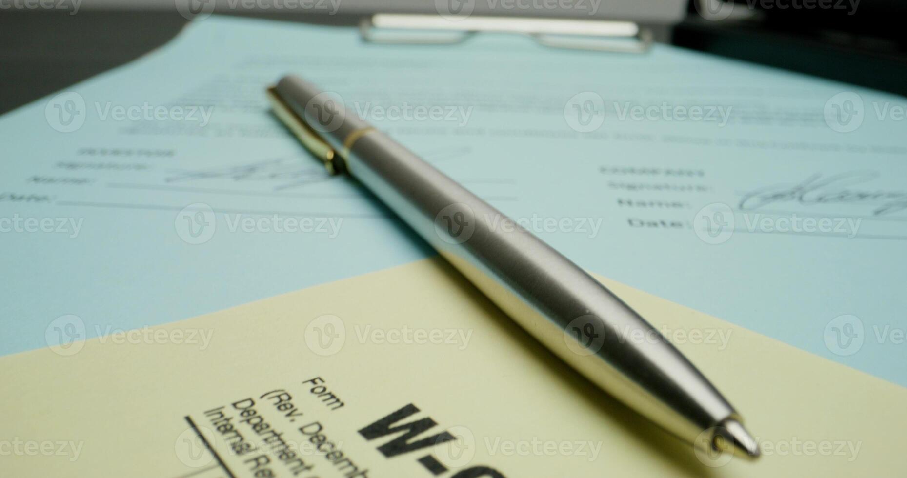 W-2 form with pen and paper photo
