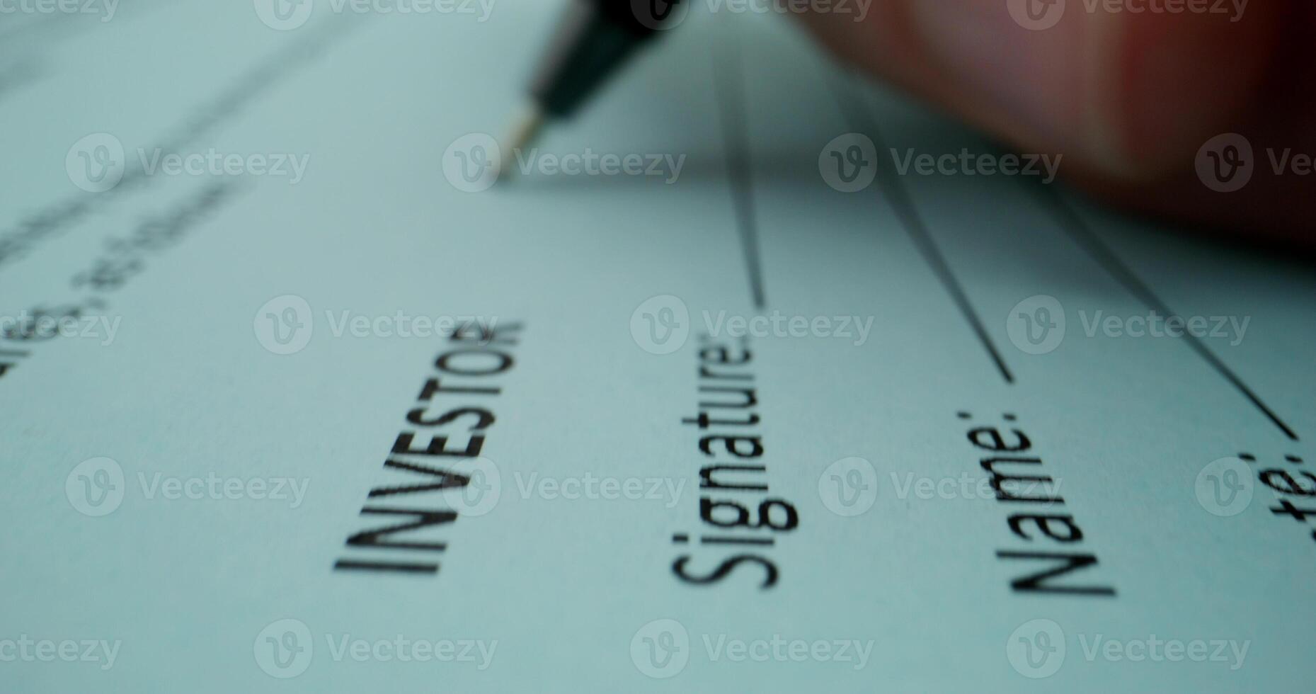 Investor signature on a document photo
