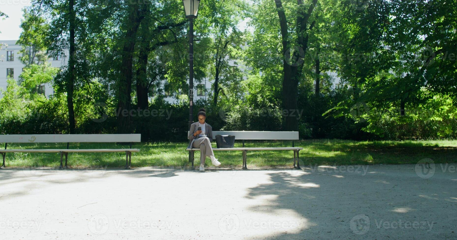 A person standing on a bench photo
