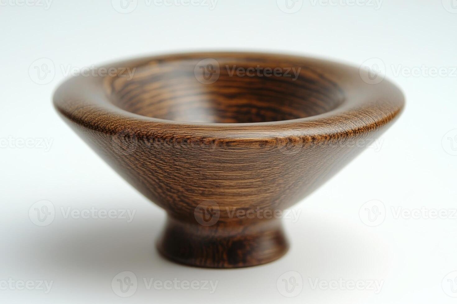 A small wooden bowl on a white surface photo