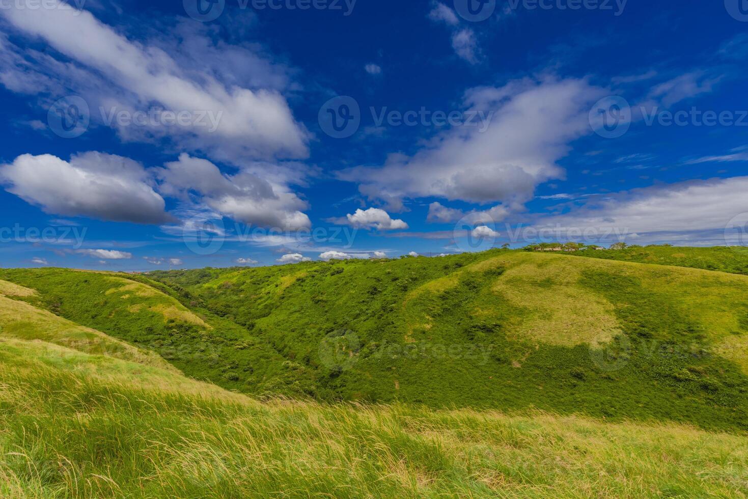 Beautiful landscape of green hills with clouds and blue sky. Panoramic viewpoint EL CRUCERO overlooking the green hills photo