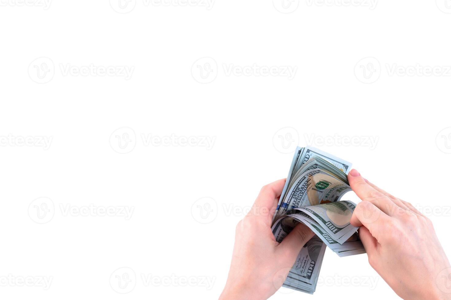 Counting paper money, American hundred dollar bills being counted by female hands. White background. Copy space. photo
