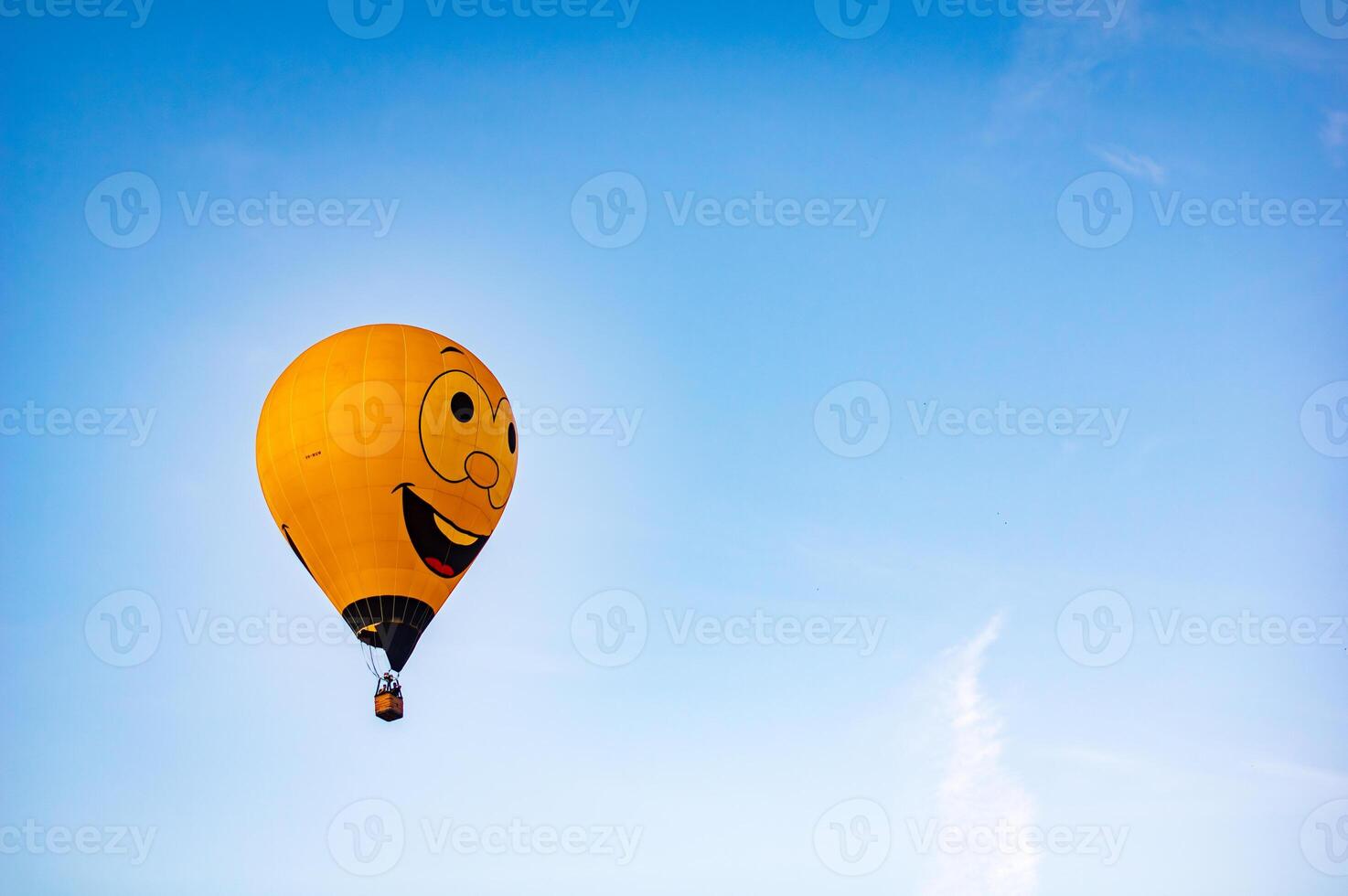 Happy face balloon with blue sky back ground photo