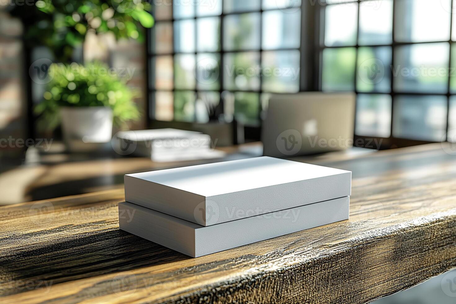 Clean box mockup on a sleek table surrounded by contemporary office elements in a well-lit workspace. photo