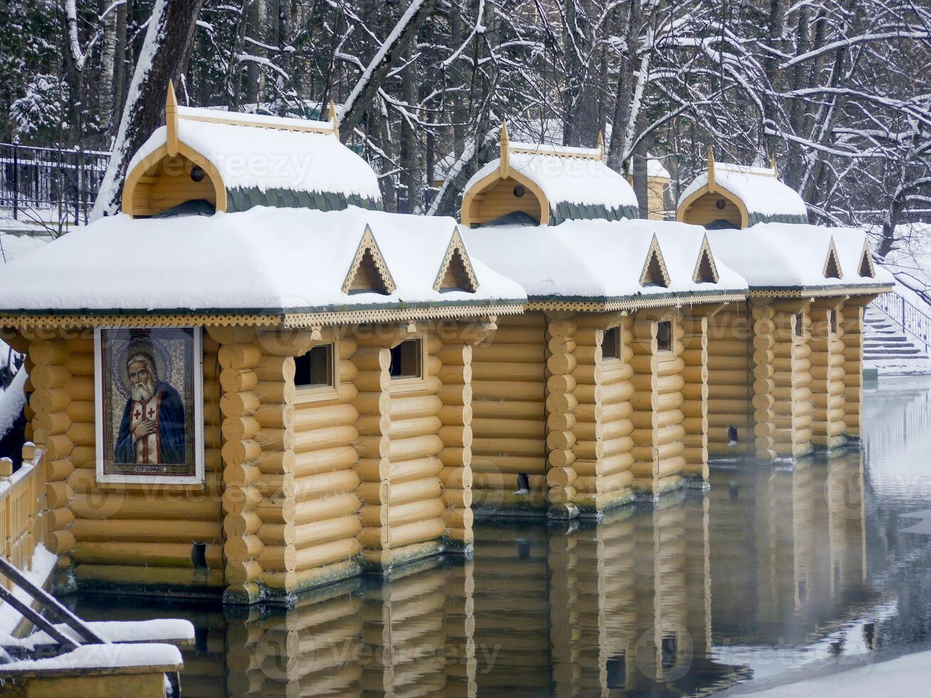Font or baptistry in Diveevo. Chapel of St. Seraphim of Sarov, holy spring, baptismal font, winter Russia Diveevo, wooden church. photo