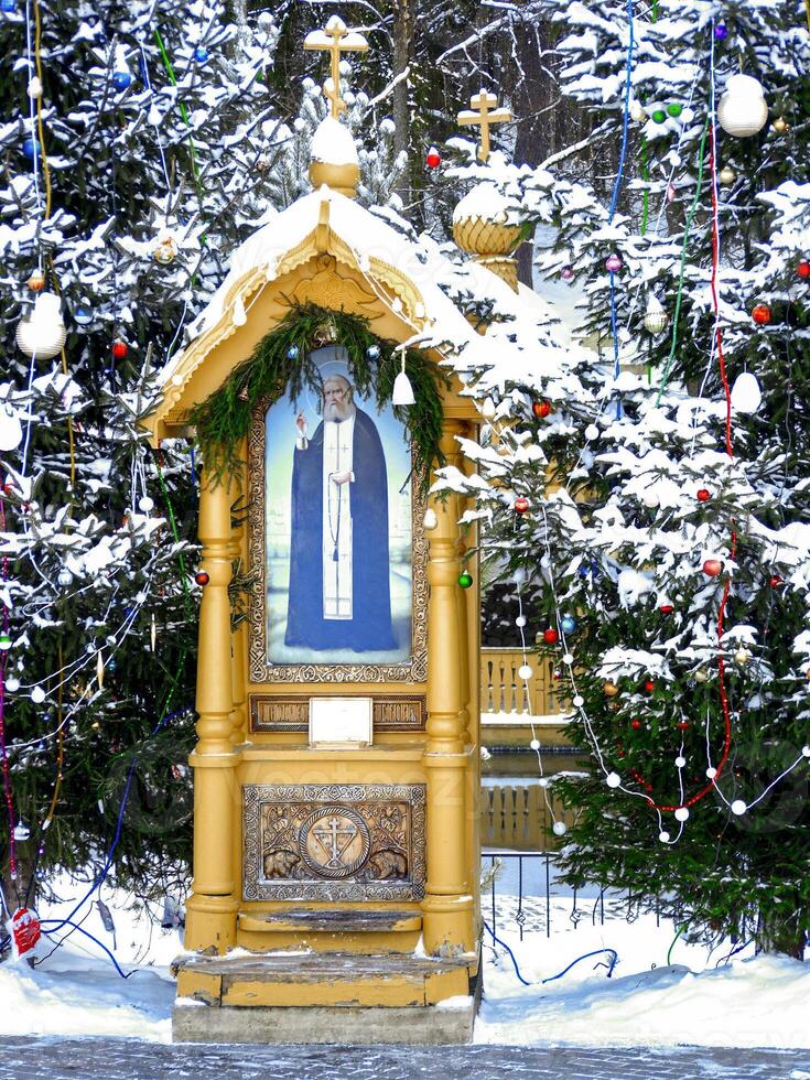 Chapel of St. Seraphim of Sarov, holy spring, baptismal font, winter Russia Diveevo, wooden church. Font in Diveevo in wintertime photo