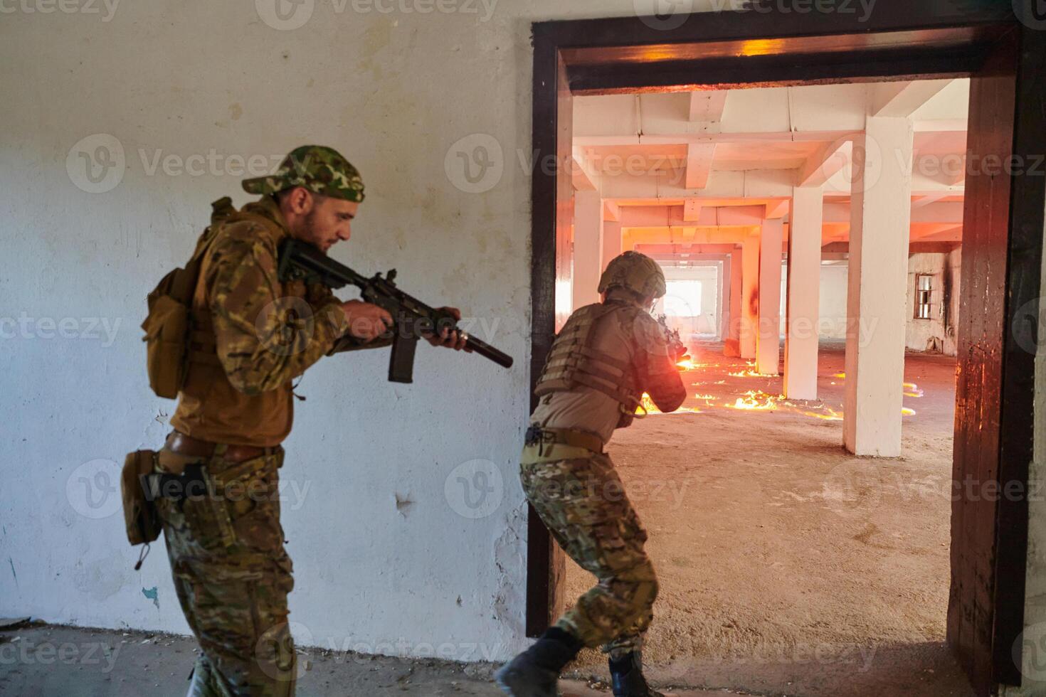 A group of professional soldiers bravely executes a dangerous rescue mission, surrounded by fire in a perilous building. photo