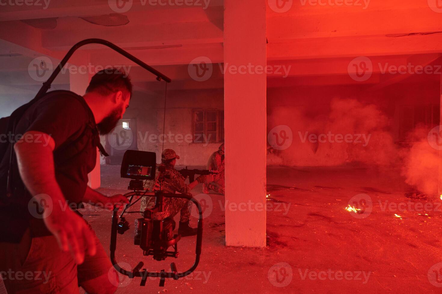 A professional cameraman captures the intense moments as a group of skilled soldiers embarks on a dangerous mission inside an abandoned building, their actions filled with suspense and bravery photo