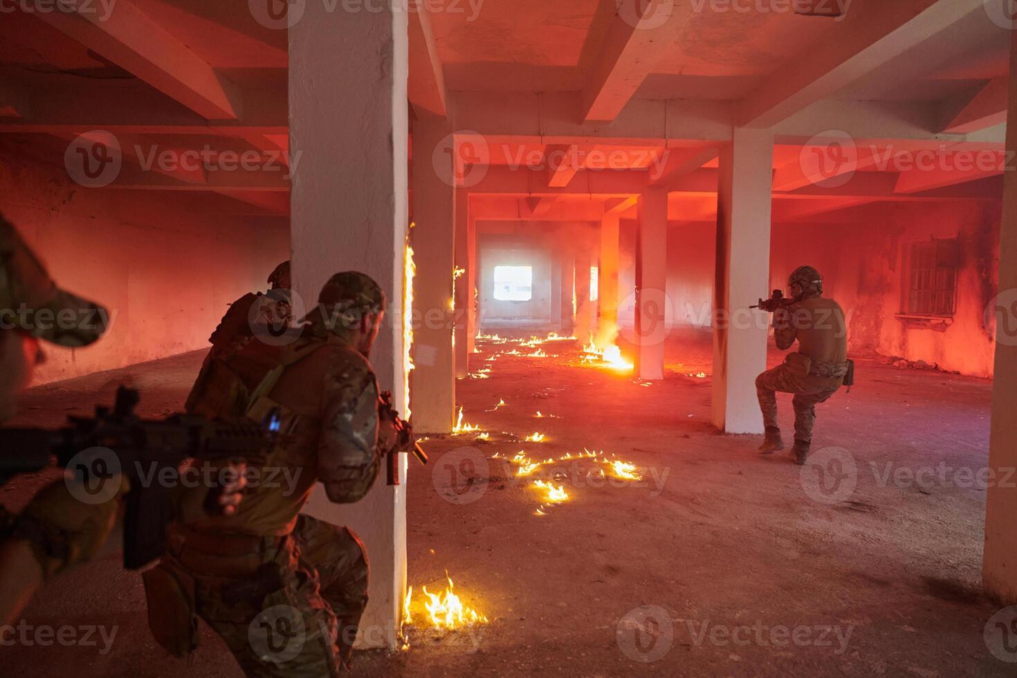 A group of professional soldiers bravely executes a dangerous rescue mission, surrounded by fire in a perilous building. photo