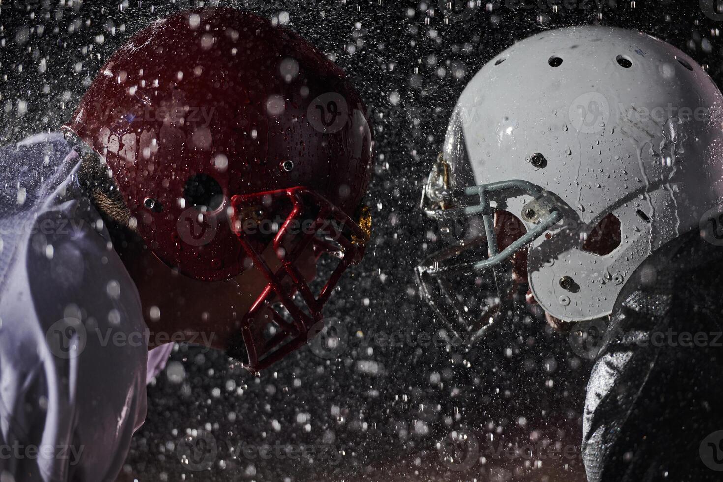 Two american football players face to face in silhouette shadow on white background photo