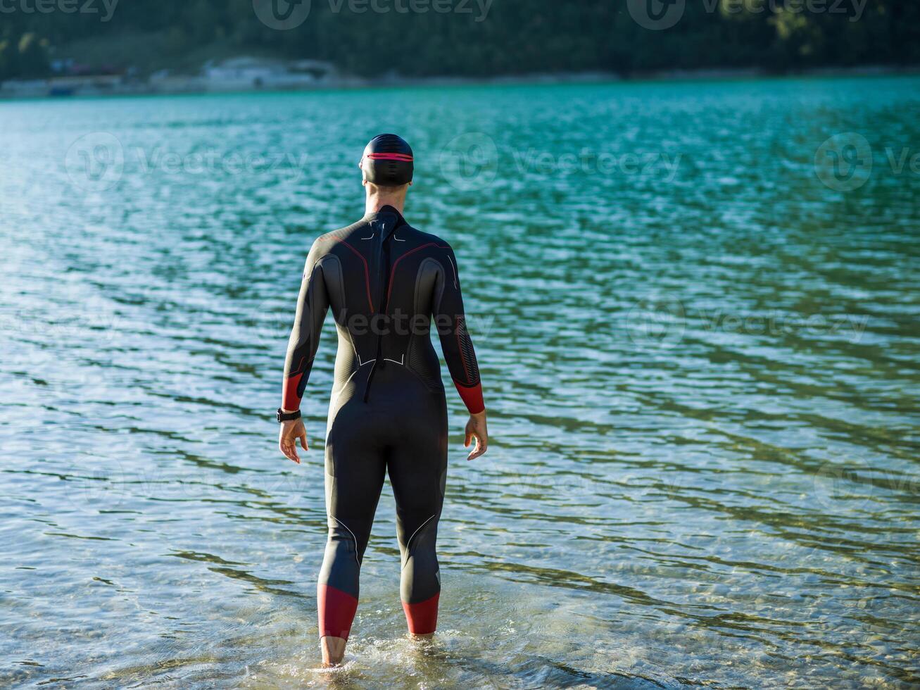 A triathlon swimmer preparing for a river training to gear up for a marathon photo