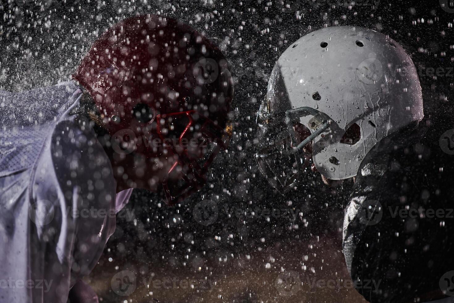 Two american football players face to face in silhouette shadow on white background photo