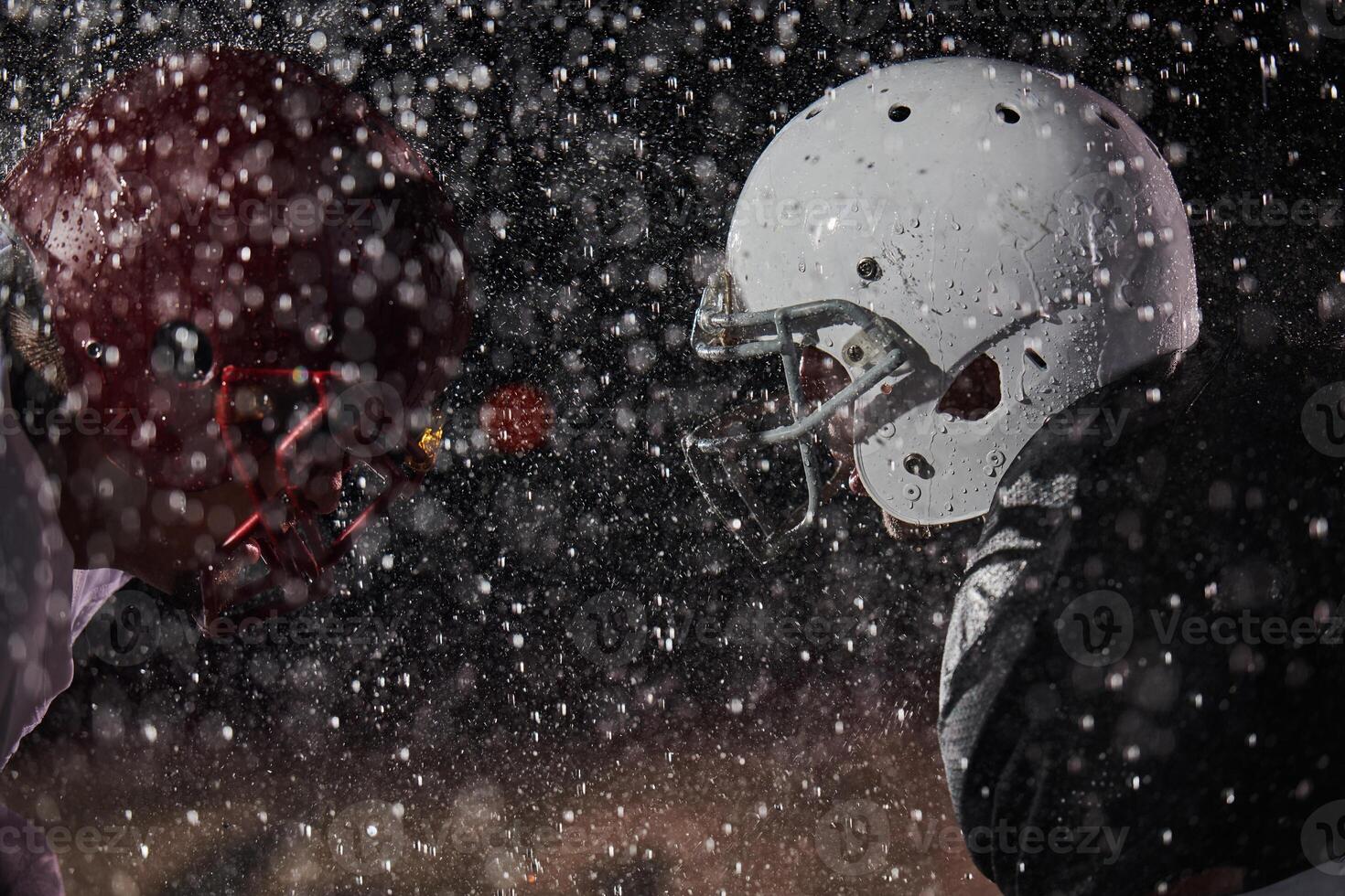 Two american football players face to face in silhouette shadow on white background photo