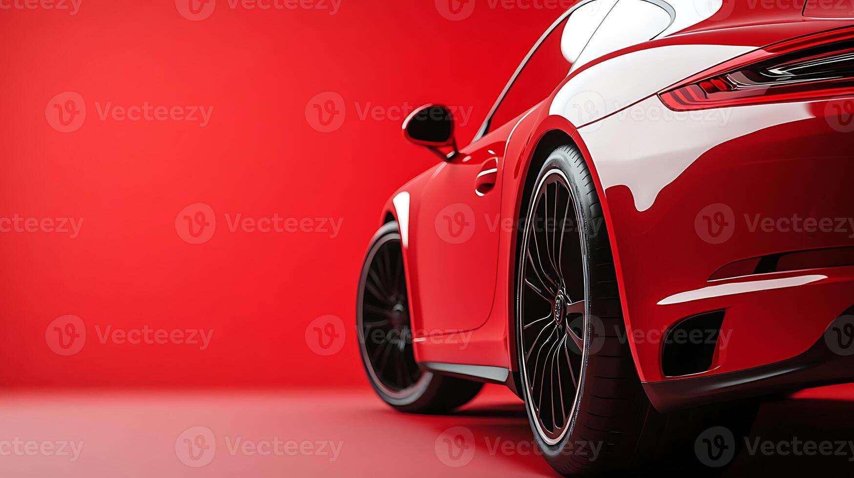 Sleek red sports car parked against vibrant red backdrop in stylish studio setting photo