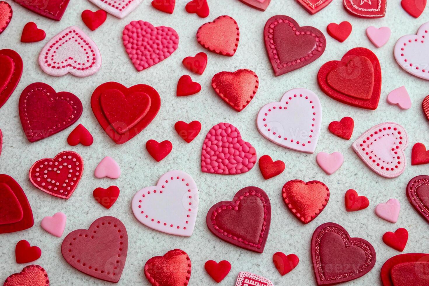 A background of many beautiful hearts for Valentine's Day. A pattern from the heart. A lot of hearts are lying on the table. View from above. photo
