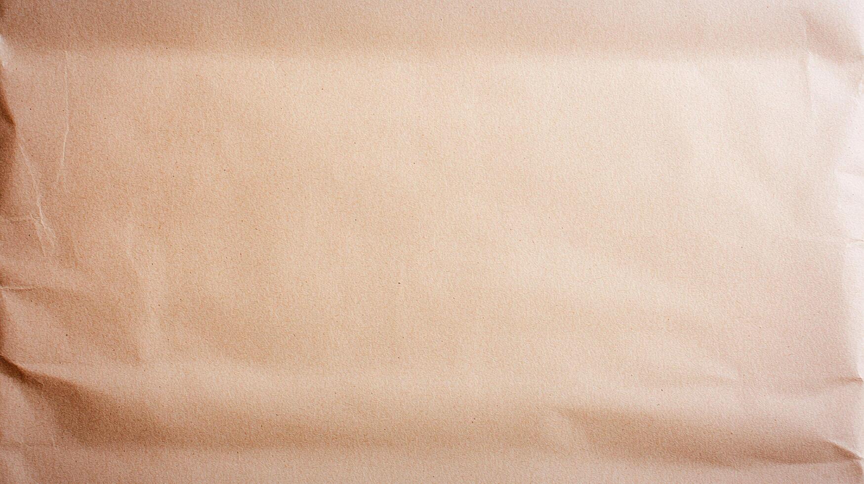 Wrinkled Brown Kraft Paper Texture with natural creases and folds, ideal for background or packaging design purposes. photo