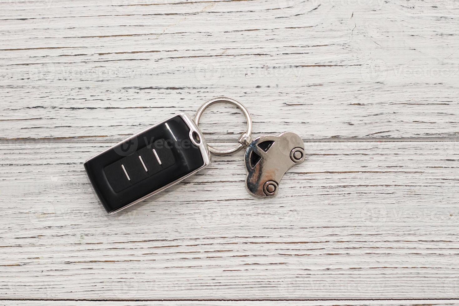 car key remote control on a wooden background photo