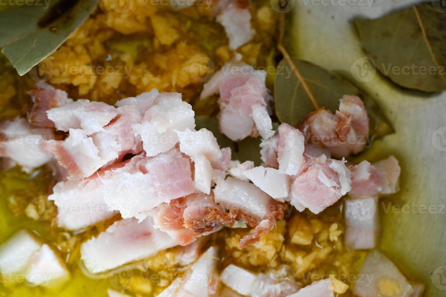 A pan with chopped meat and leaves on it photo