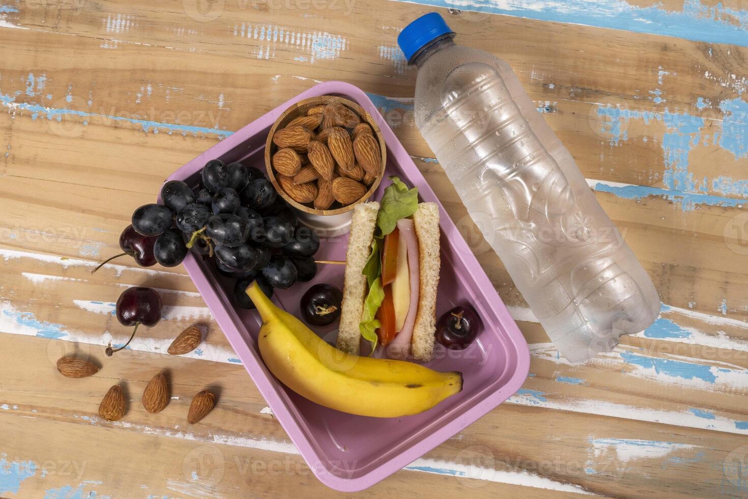 School lunch presentation. Top view showing lunch box filled with nutritious foods, protein photo