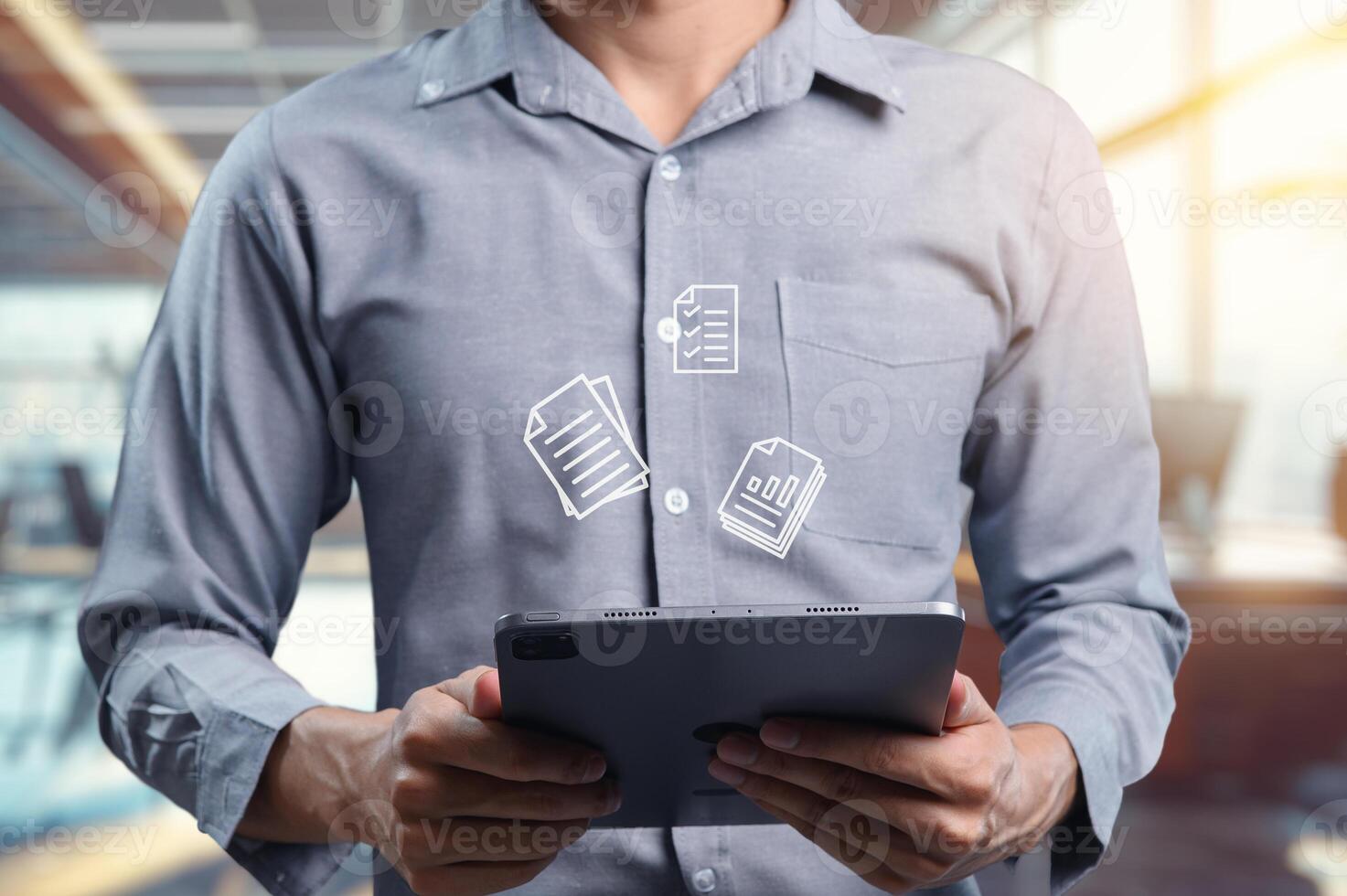 Businessman Checks Important Documents on Digital Tablet in Office photo
