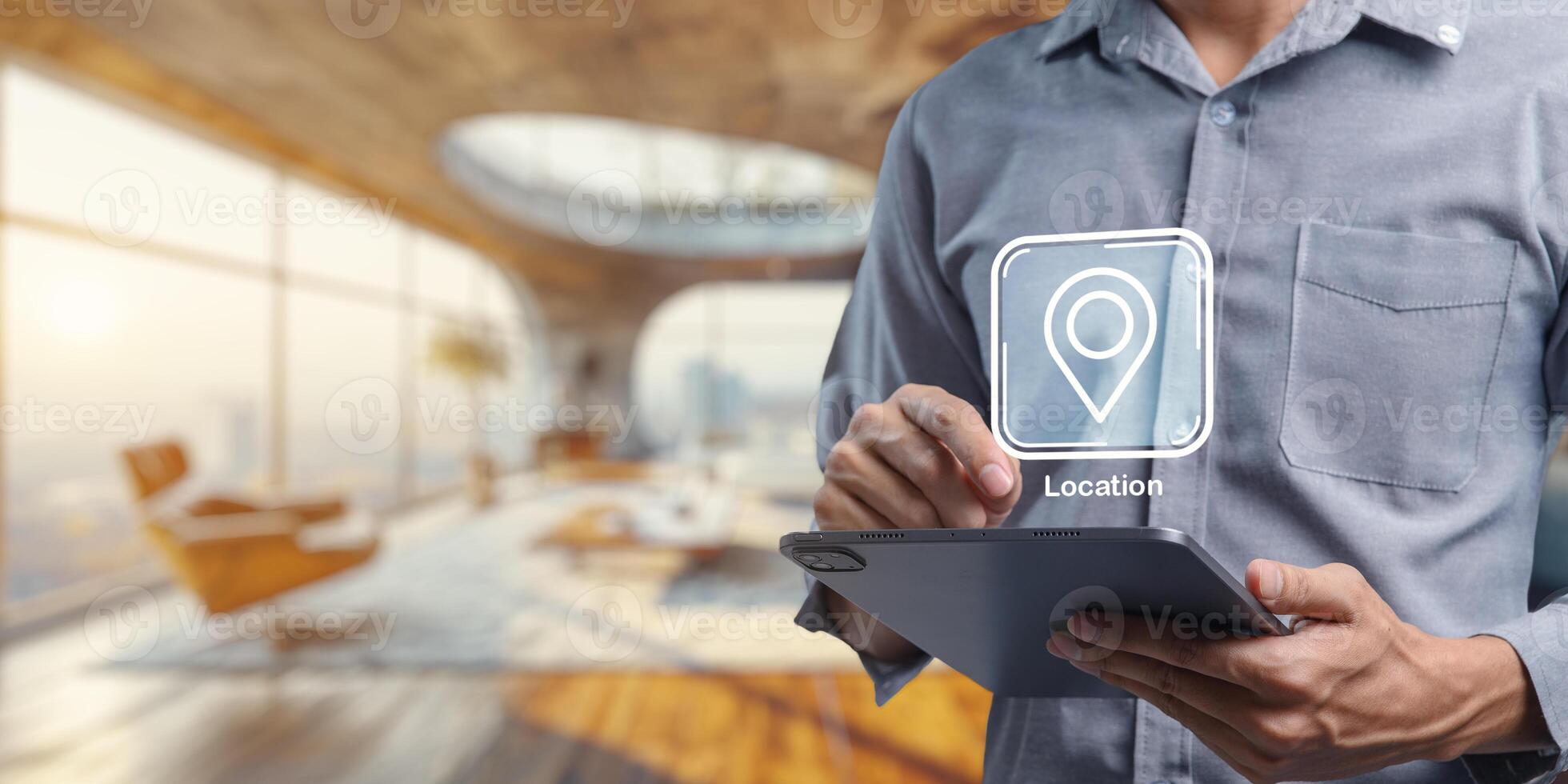 User Interacting with Location Icon on Tablet in Modern Interior Space photo