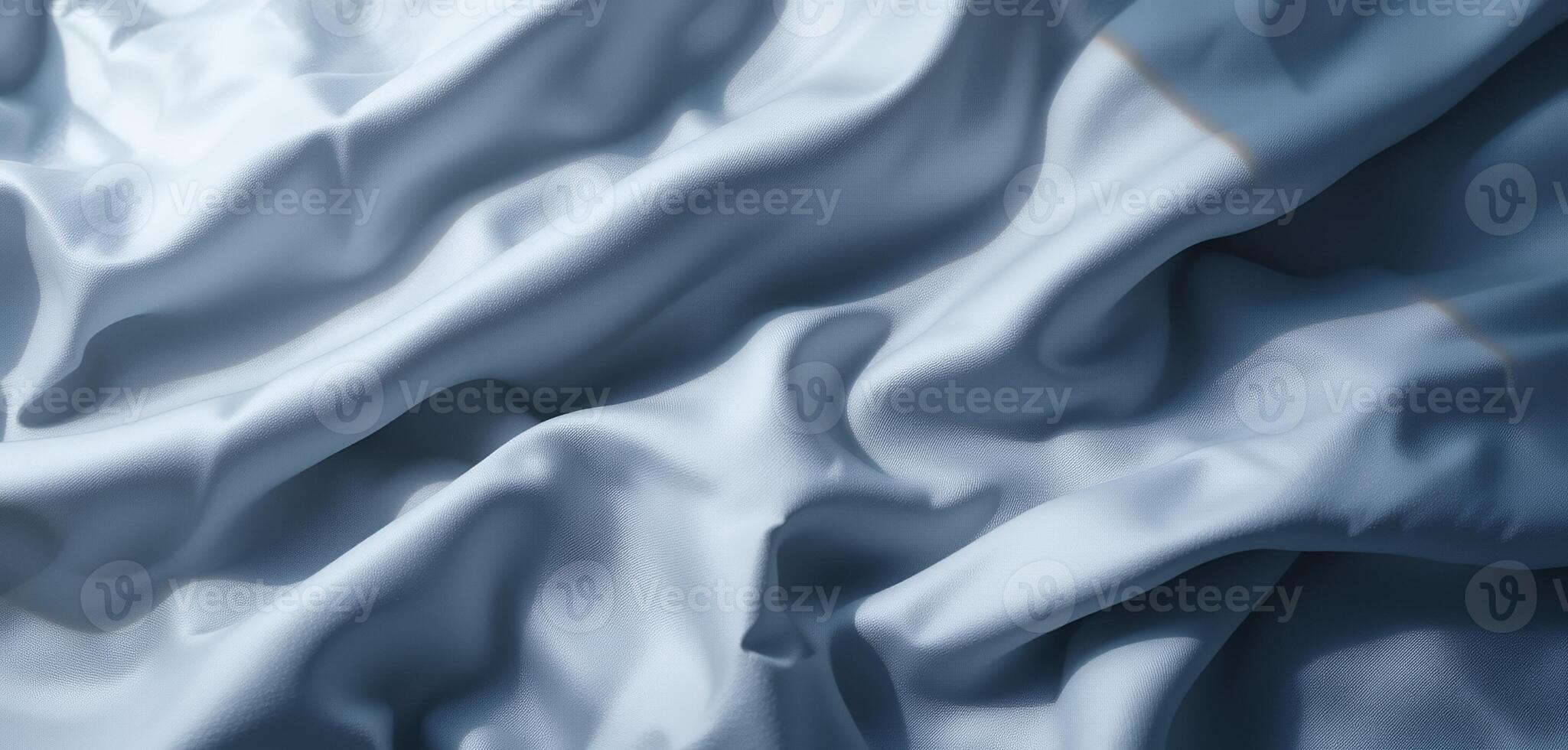 Soft, flowing fabric in gentle blue hues, with a delicate texture photo