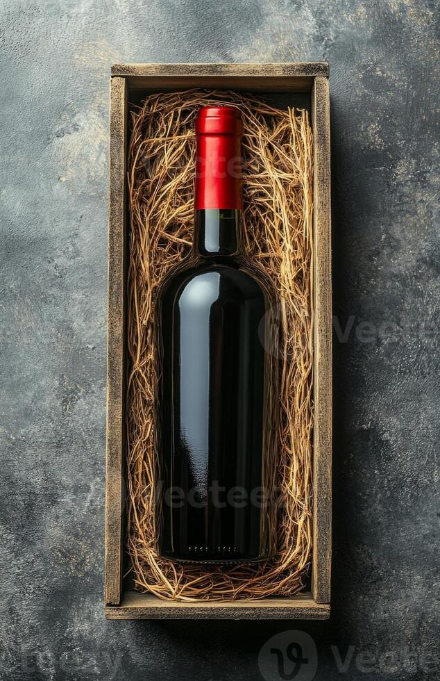 A bottle of red wine in a wooden box photo