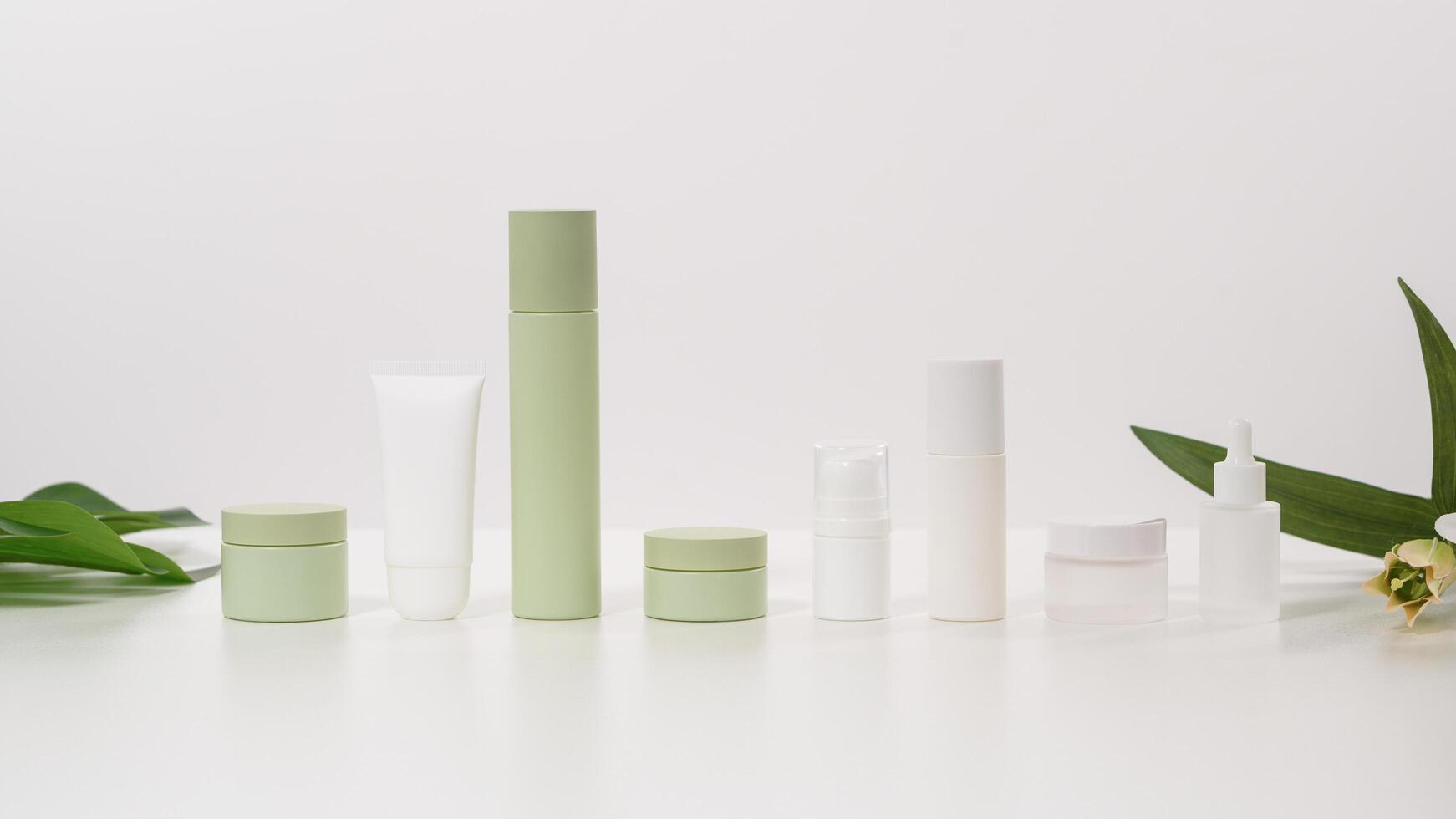 Elegant Display of Skincare Products Arranged on a Light Surface With Natural Elements photo
