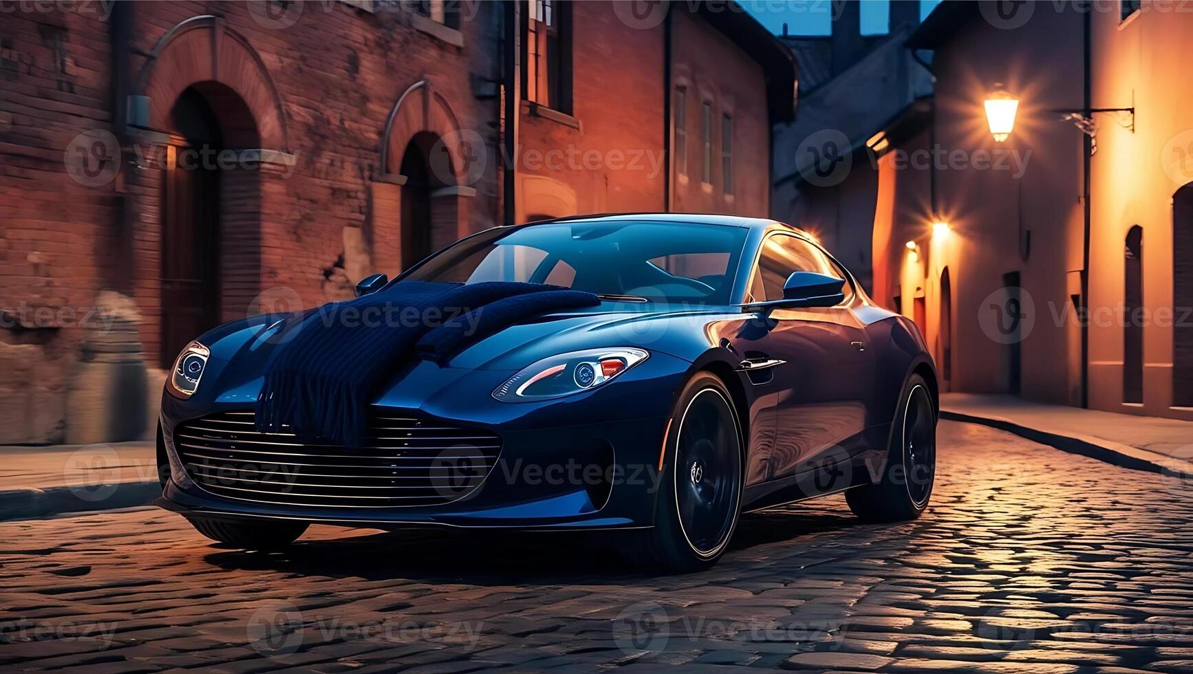 A sleek blue sports car with a scarf on its hood parked on a cobblestone street under warm evening lights. photo