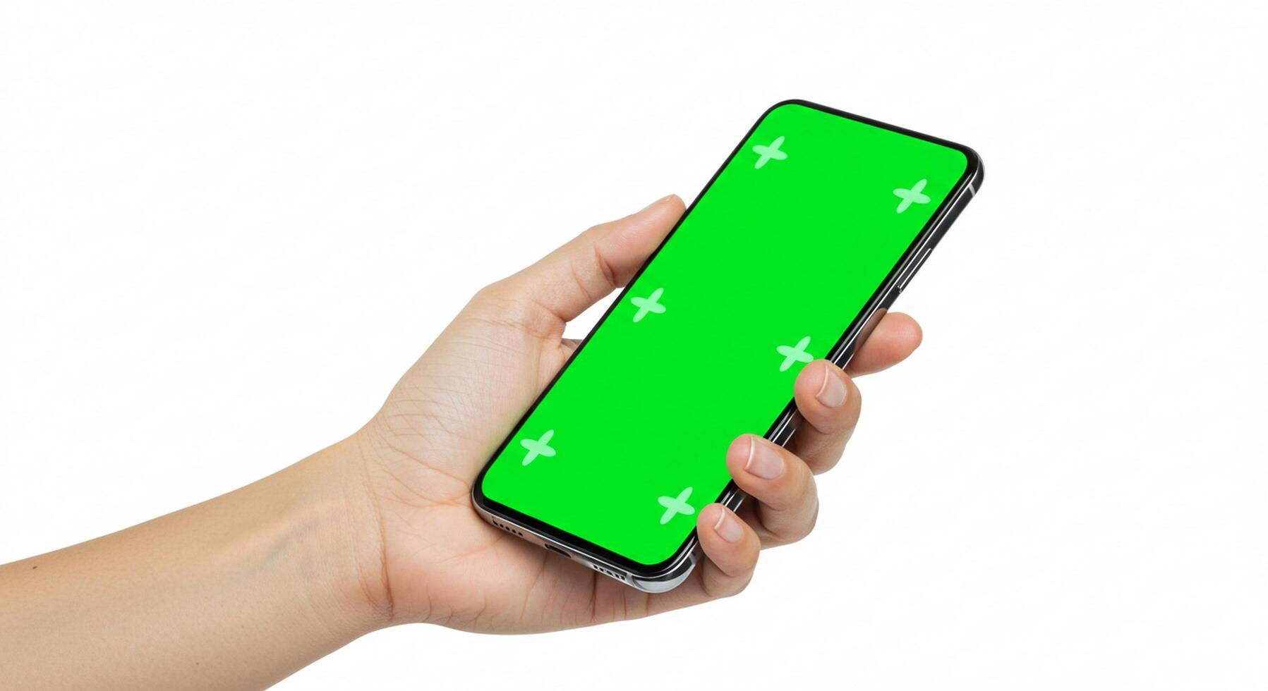 A hand holding a green screen on a phone photo