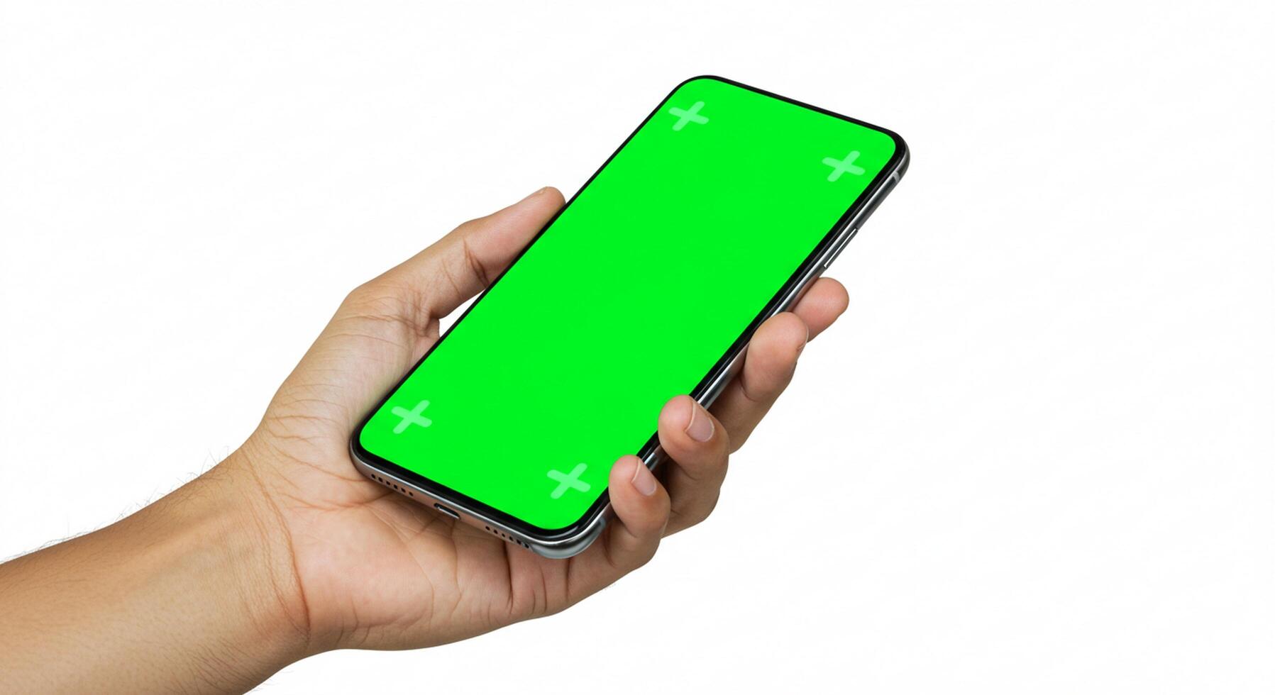 Hand holding a mobile phone with green screen, on a white background photo
