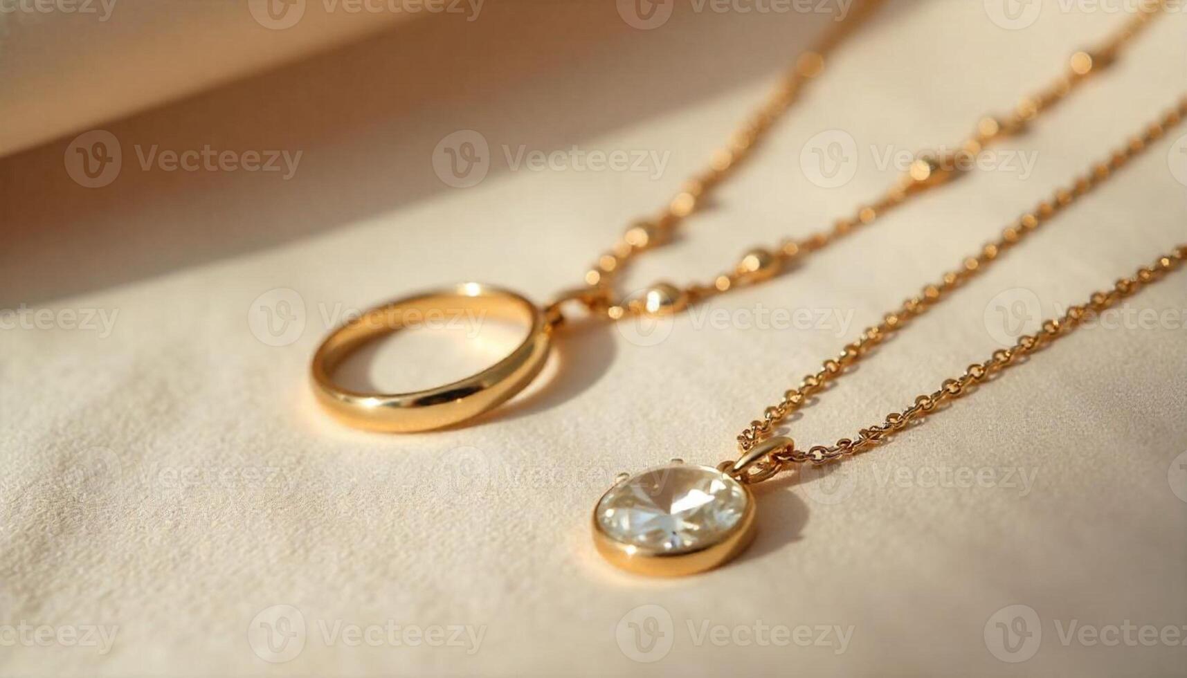 Two gold necklaces with a circle and a diamond photo