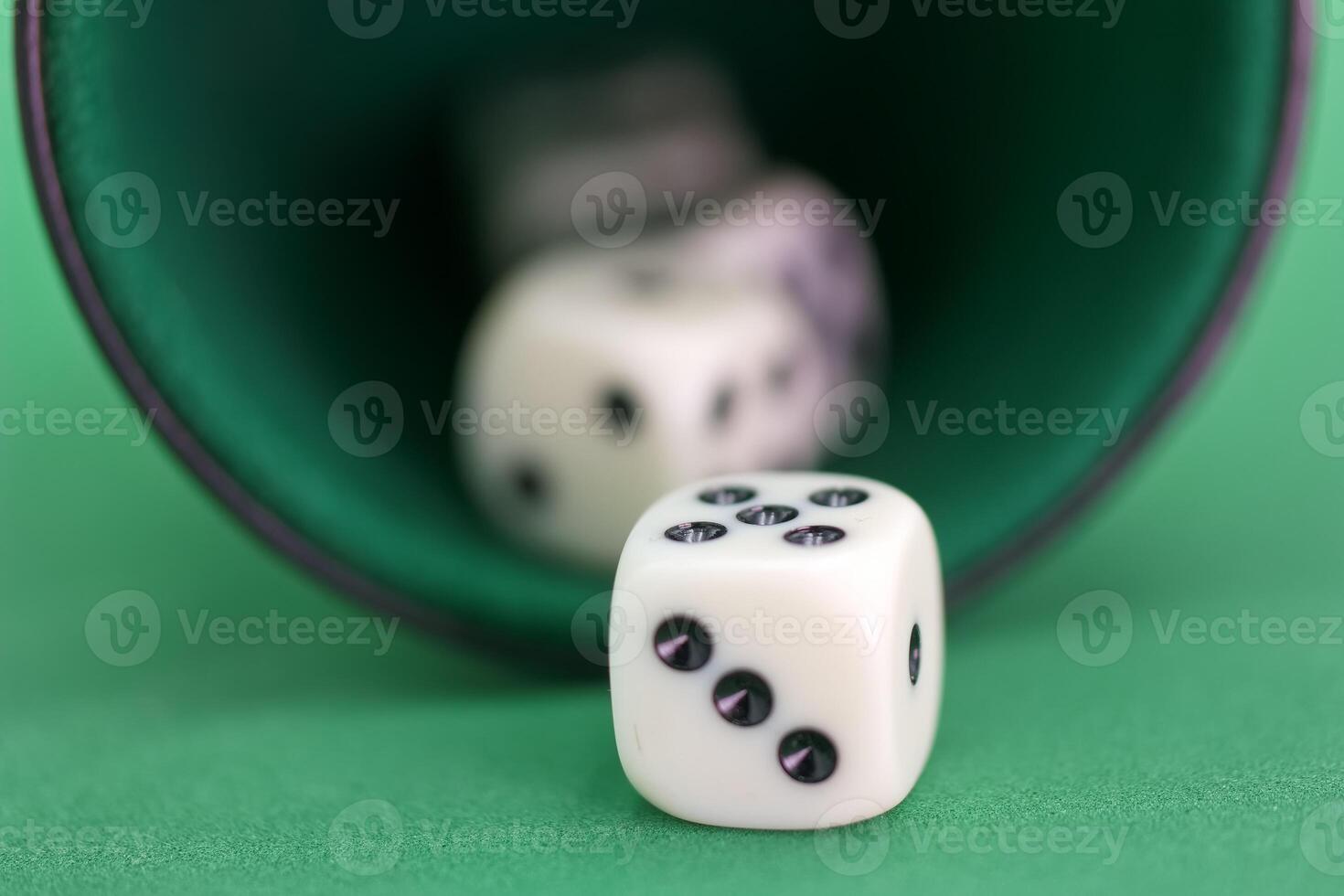 on a green felt surface during a game nigh photo