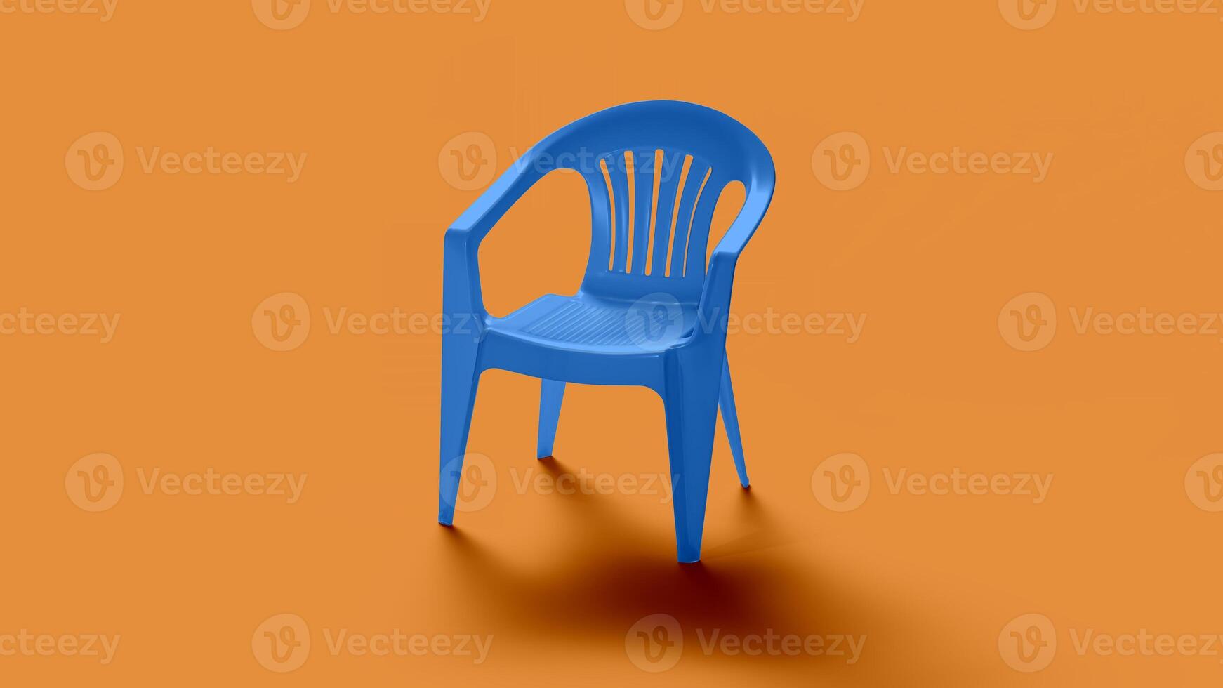 Blue basic plastic chair on orange backdrop photo