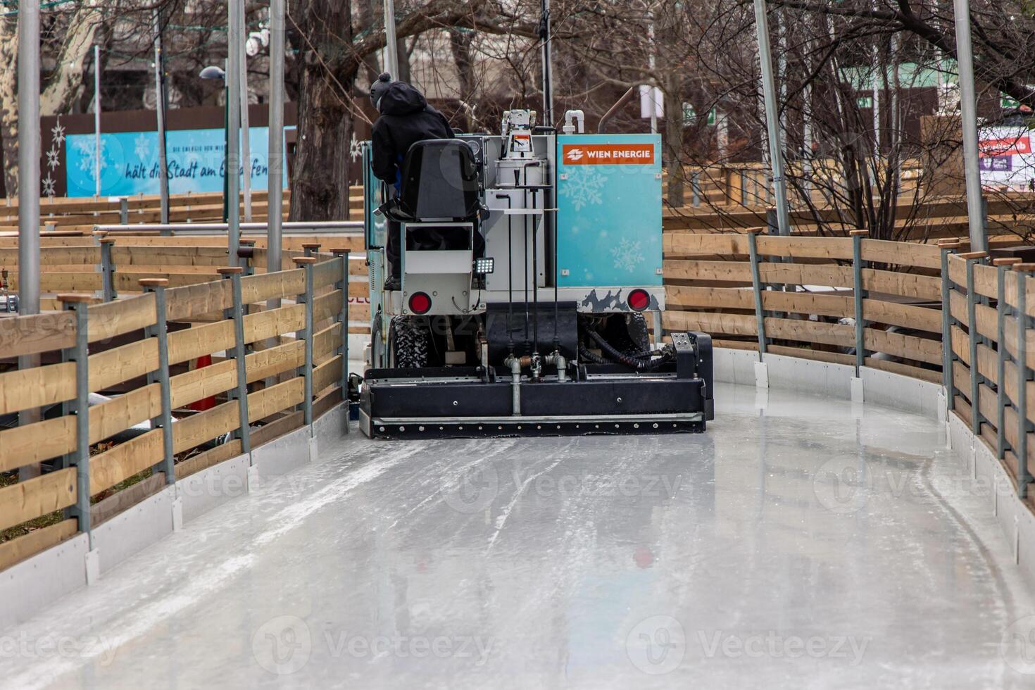 Ice resurfacing machine smoothing ice rink in Vienna photo