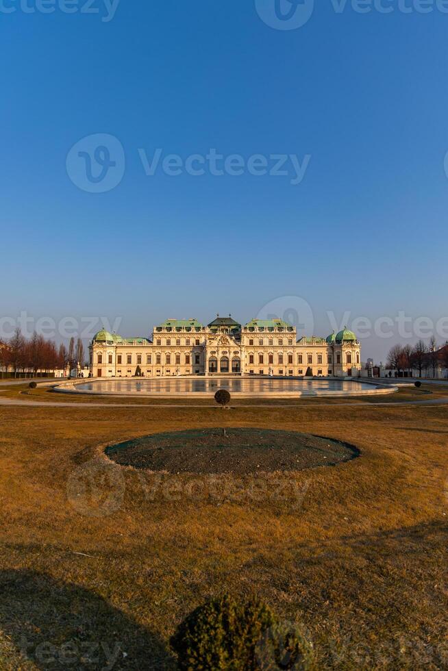 Belvedere Palace reflecting in the water on a sunny day in Vienna photo