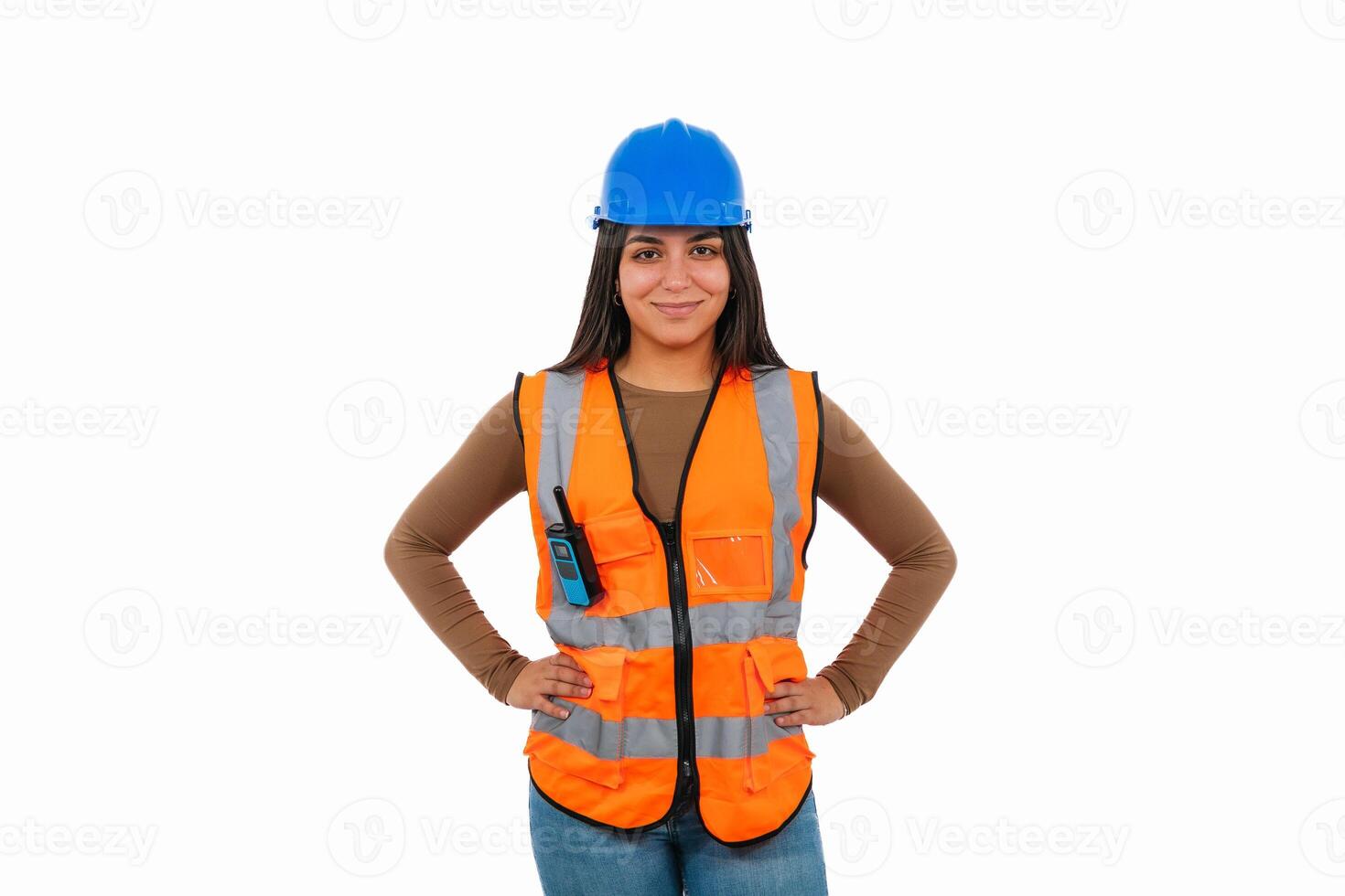 Confident latin construction worker woman posing with hands on hips photo