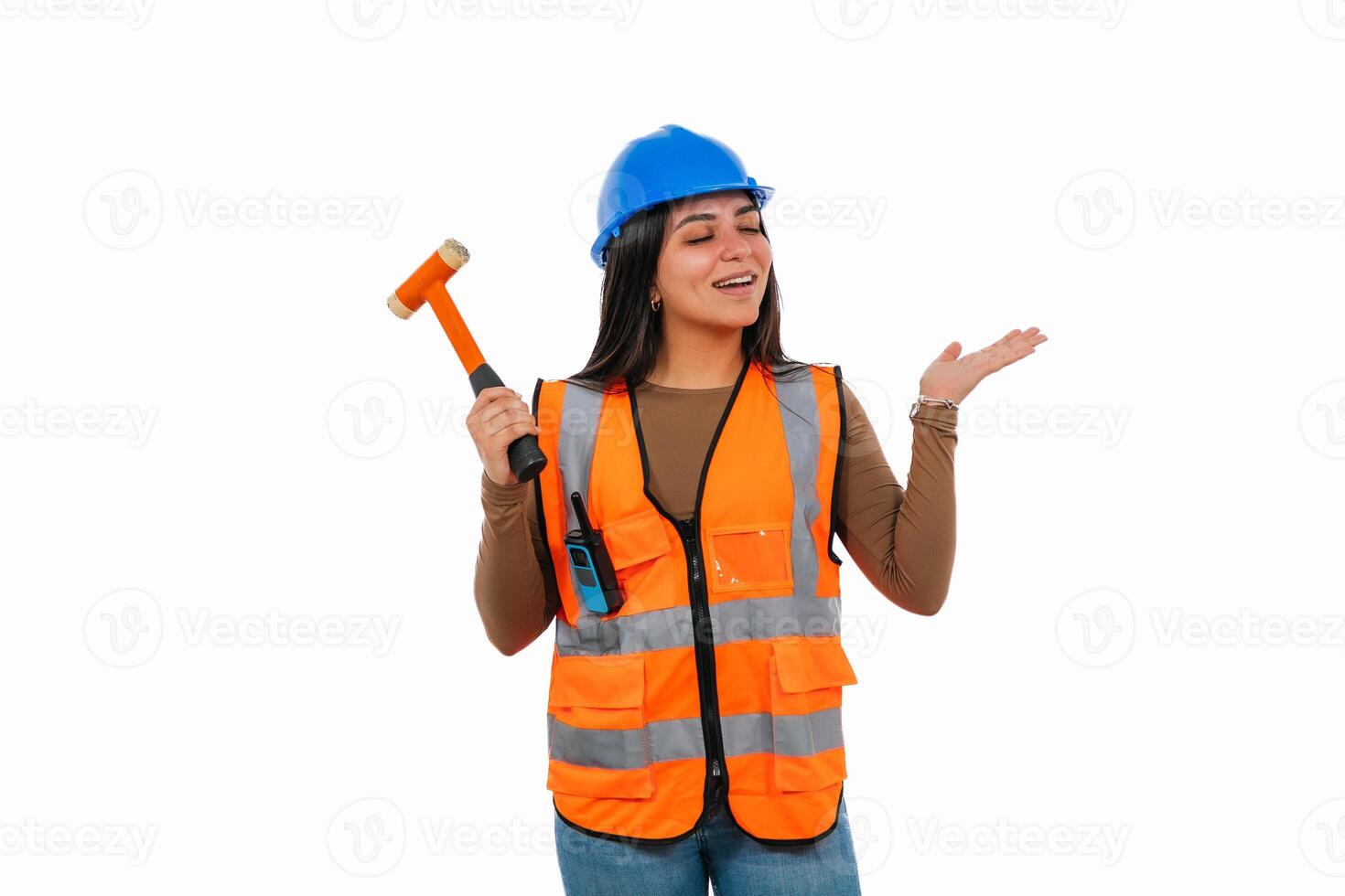 Construction worker woman holding hammer and gesturing with hand photo