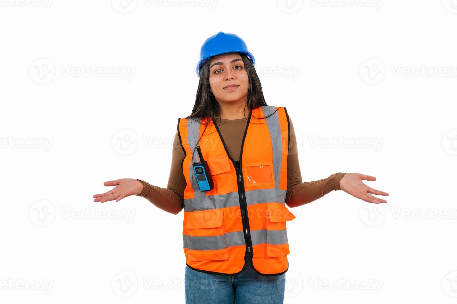 Latina construction worker shrugging shoulders wearing safety vest and hardhat photo